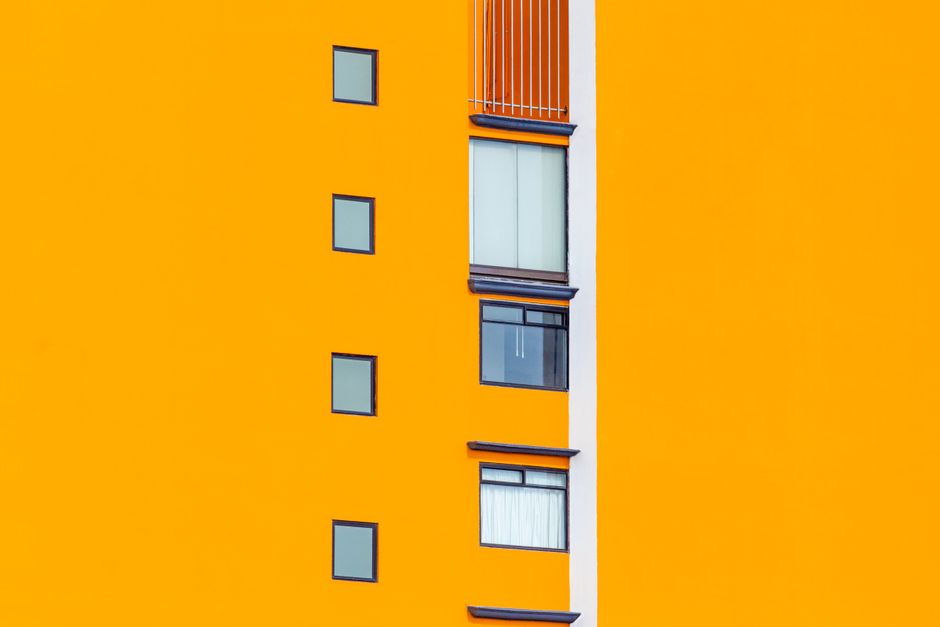 House facade with fresh paint under a clear sky