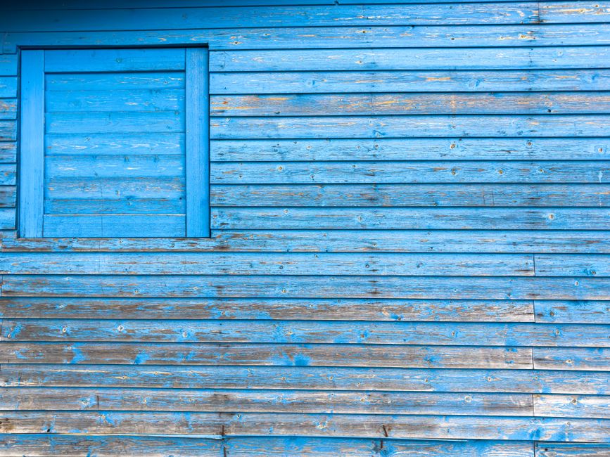 House facade with fresh paint under a clear sky